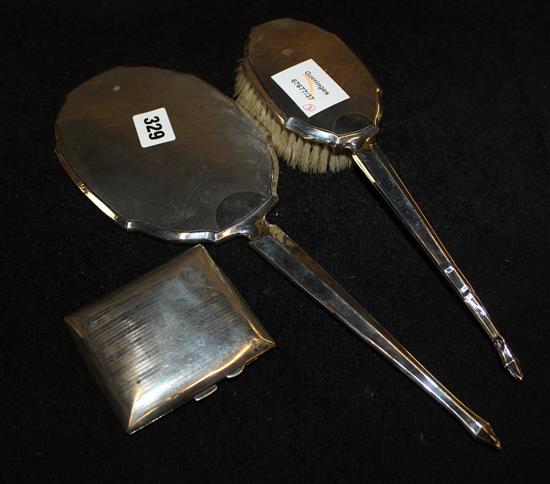 A silver ladys hand mirror & brush set and a silver cigarette case